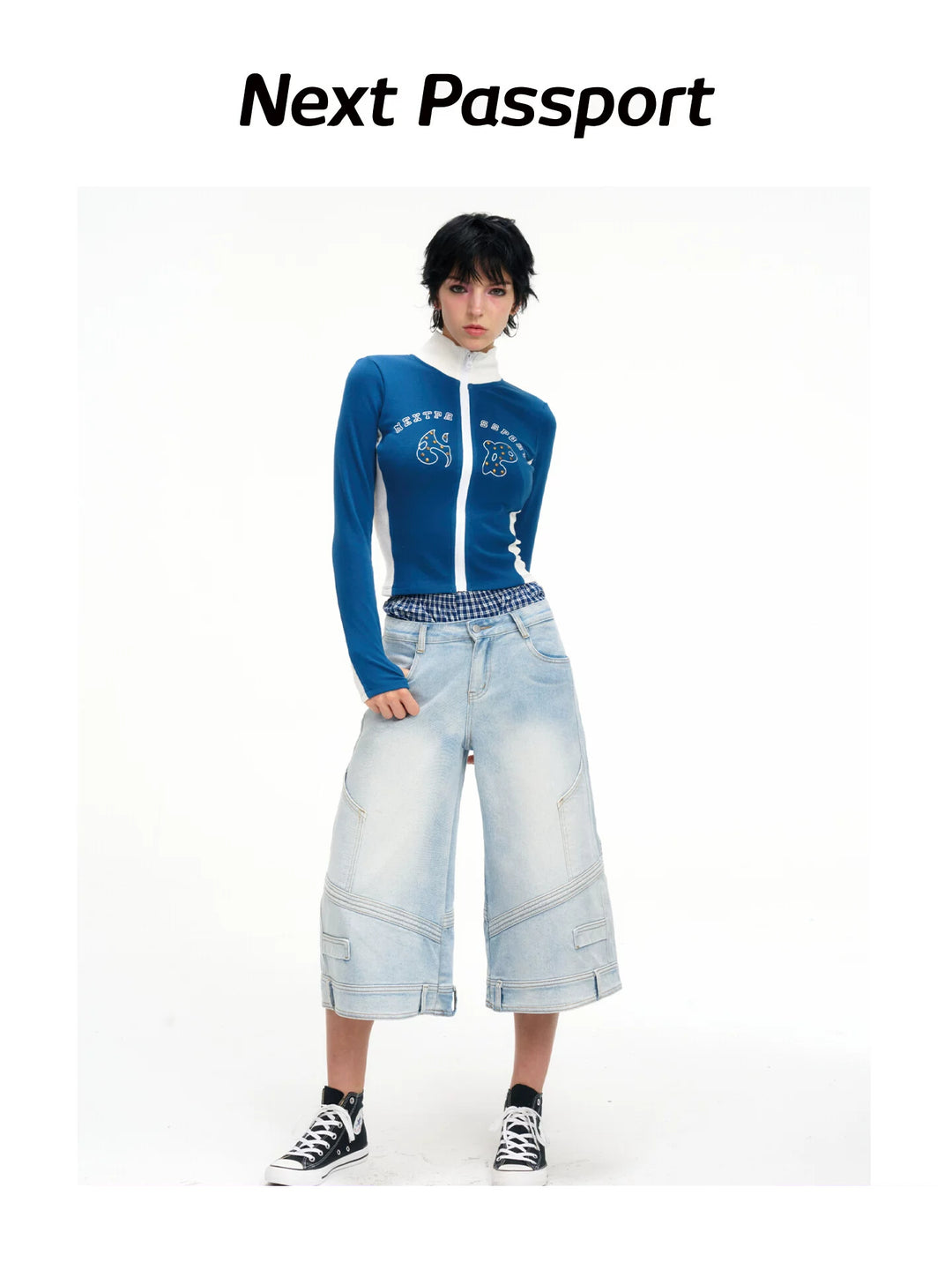 Front white-background view of the light-wash layered-waist cropped jeans