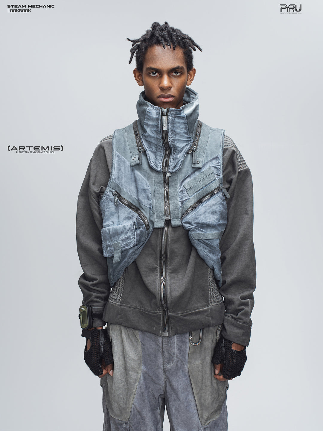 FISSION modular vest in star blue, front modeled view showing the high collar and cargo pockets