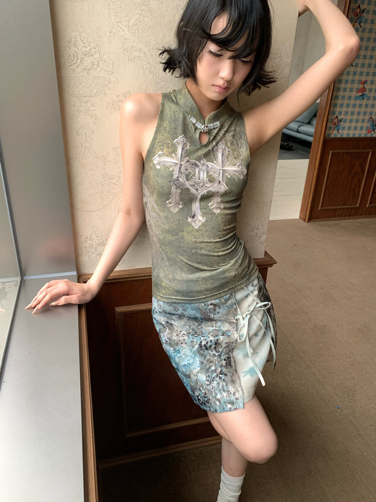 4RE1GN TRIPLE CROSS mandarin sleeveless top in olive green — front modeled view with the BLUE BLOOM layered skirt