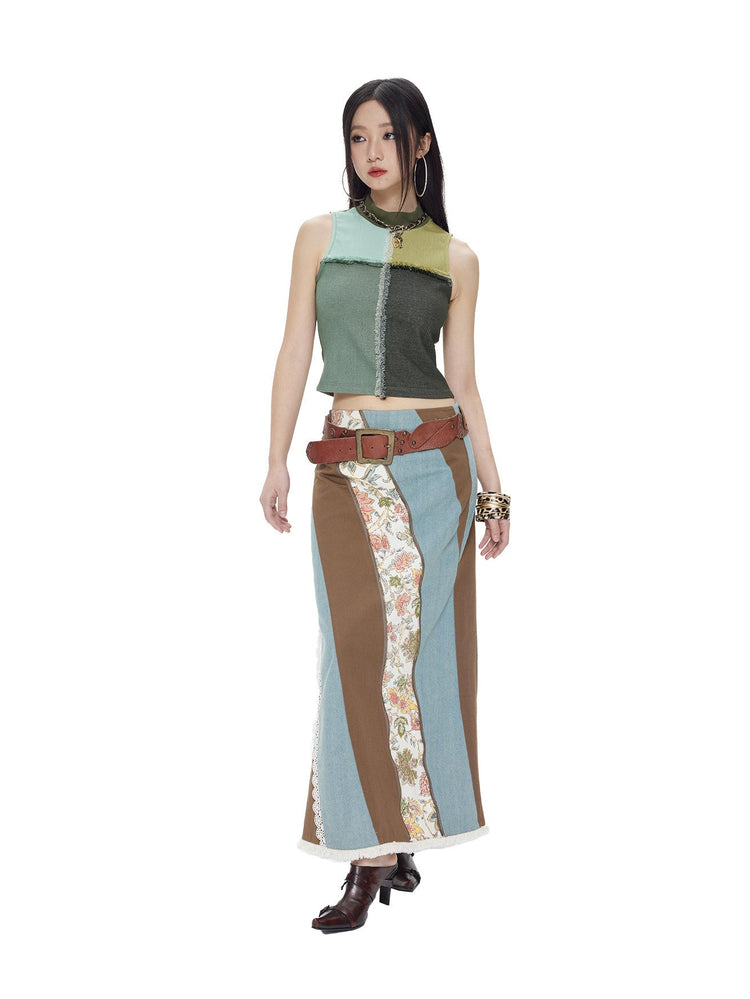NEXT PASSPORT mesh-panel mock-neck vest in field green with coordinating patchwork maxi skirt, full-look studio view.
