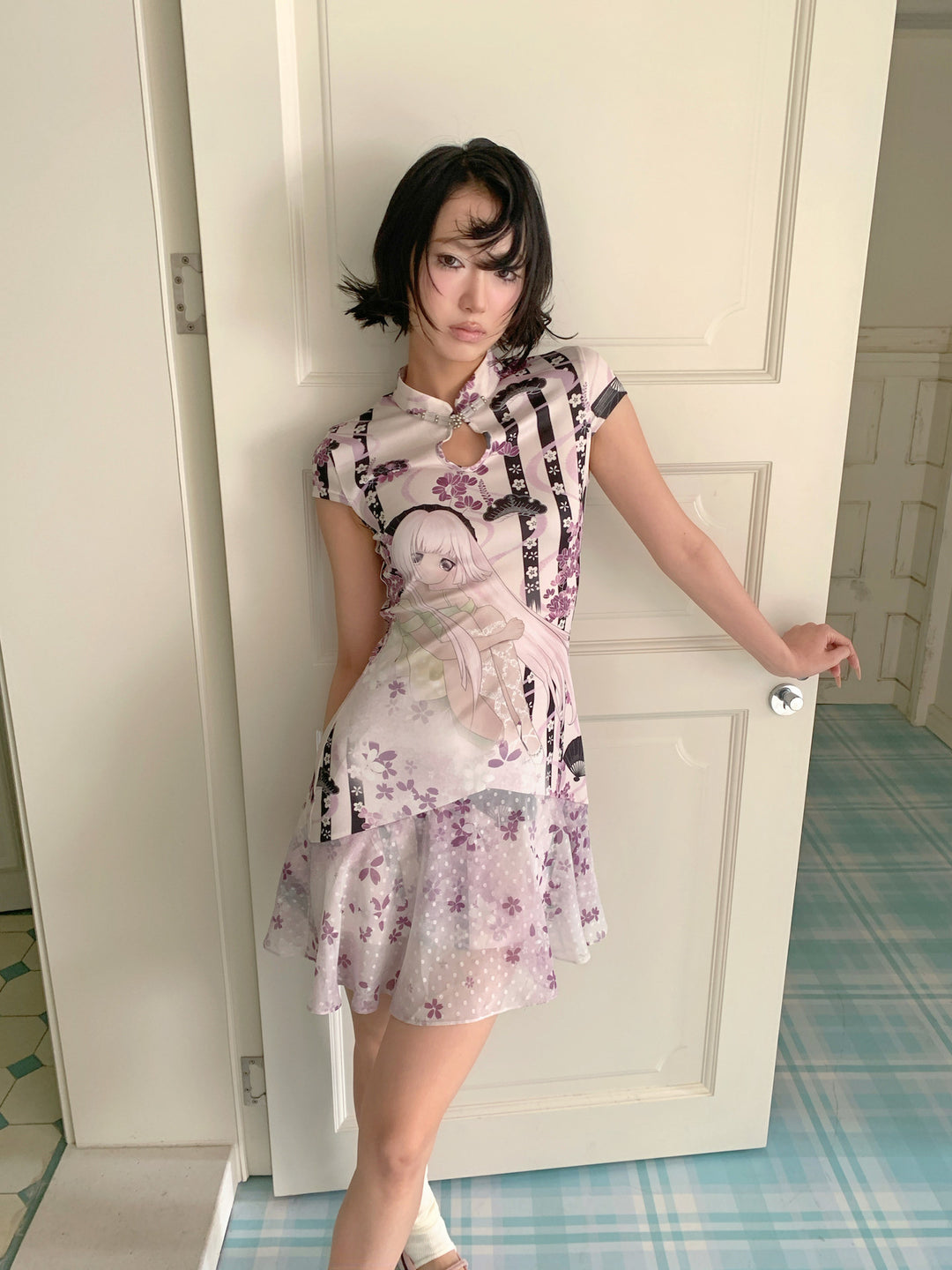 4RE1GN PURPLE MOOD mandarin-collar dress in multicolor — front three-quarter modeled view in a doorway