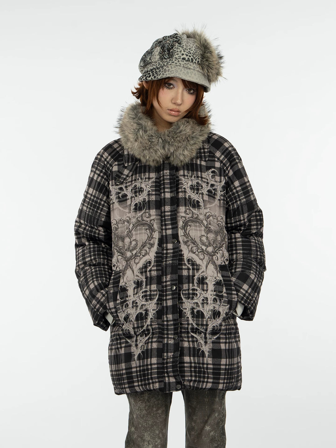 4RE1GN BEARHEART plaid long down coat in brown multicolor — front modeled view with the furry collar and hands in pockets