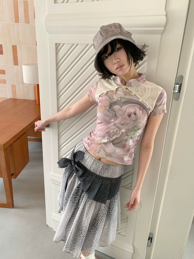 4RE1GN PINK REAPER lace-panel mandarin tee in pink multicolor — close front modeled view with a printed bucket hat