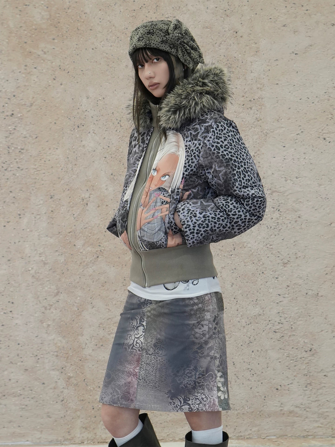 4RE1GN NAILS DONE leopard graphic down jacket in gray multicolor — three-quarter modeled view with the hood down
