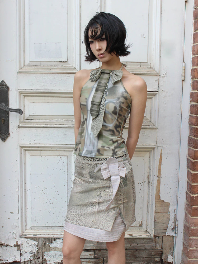 4RE1GN CROSS LEOPARD bow-detail layered skirt in beige multicolor — three-quarter modeled view showing the bow and layered hem