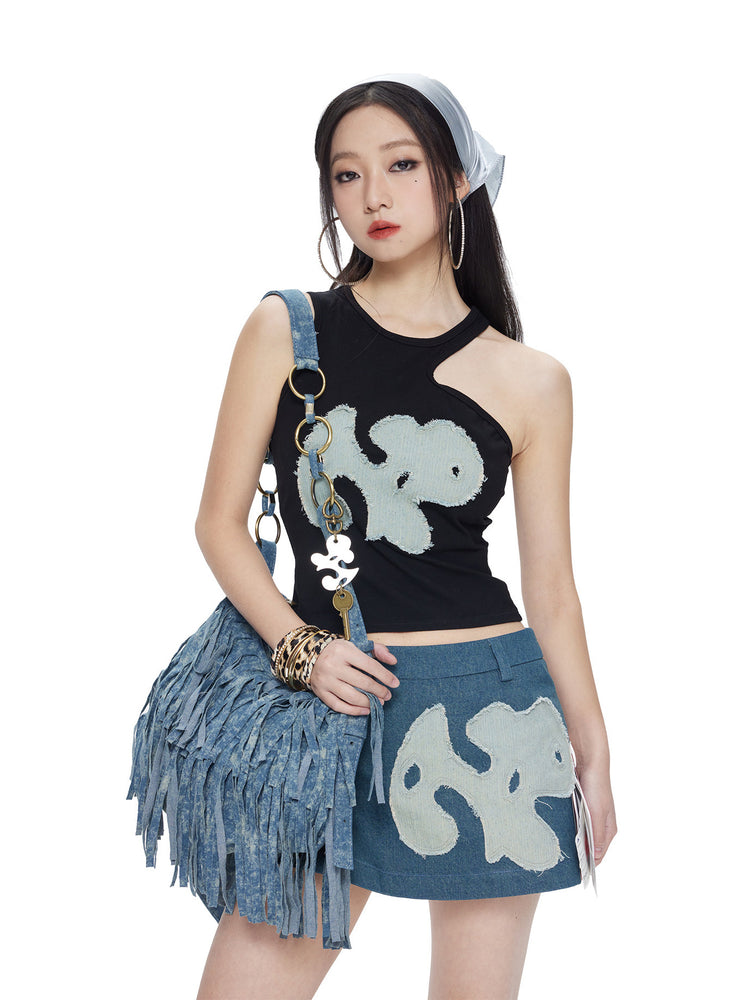 NEXT PASSPORT black-blue asymmetric appliqué cutout tank top — front studio view.
