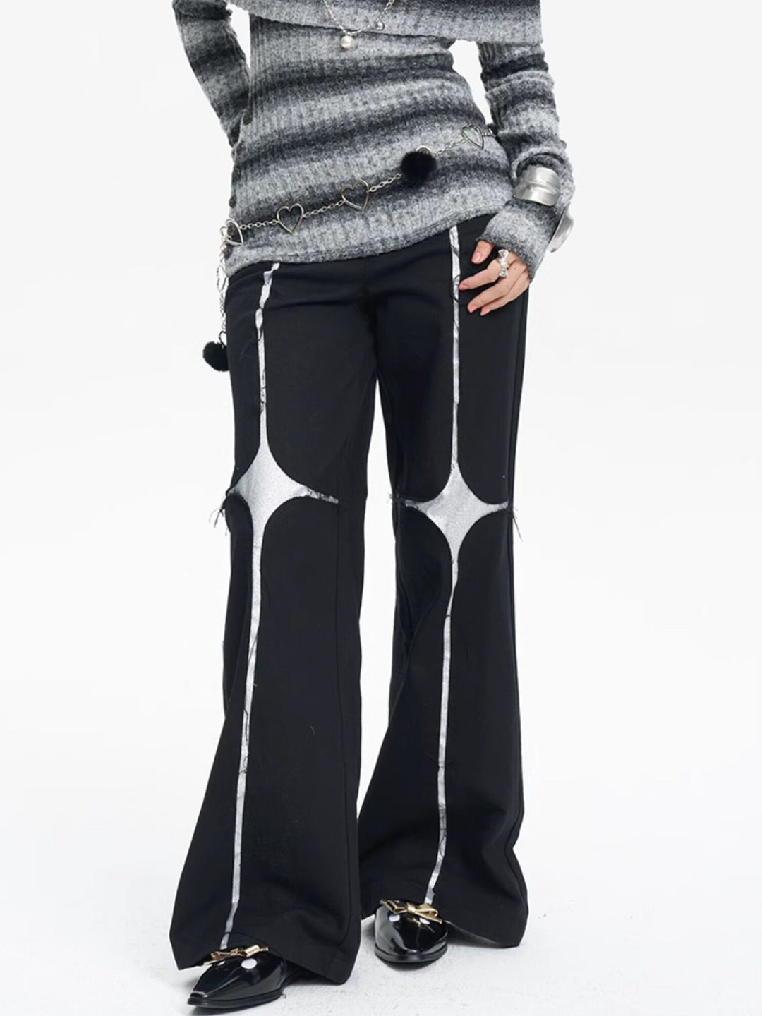 NEXT PASSPORT black silver-cross sequin wide-leg pants — front close-up.