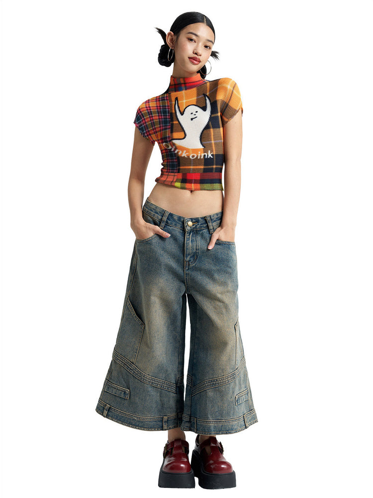 Front view of NEXT PASSPORT deconstructed wide-leg denim capri pants