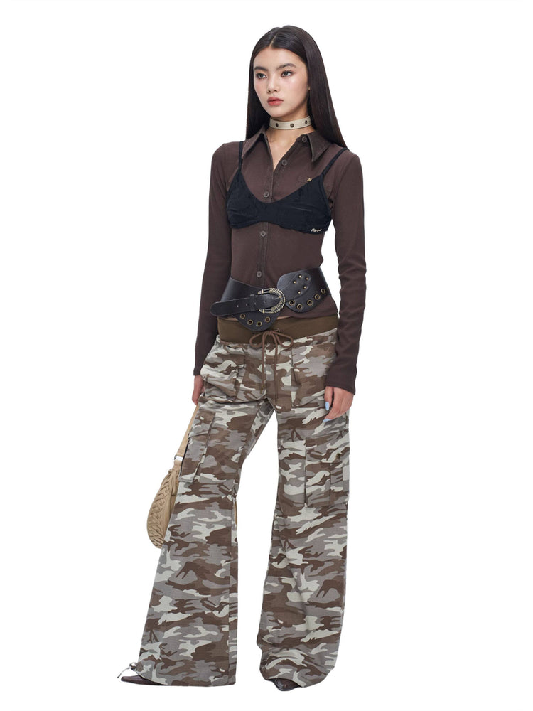 NEXT PASSPORT camouflage ribbed-waist flared pants — full-length front studio view.