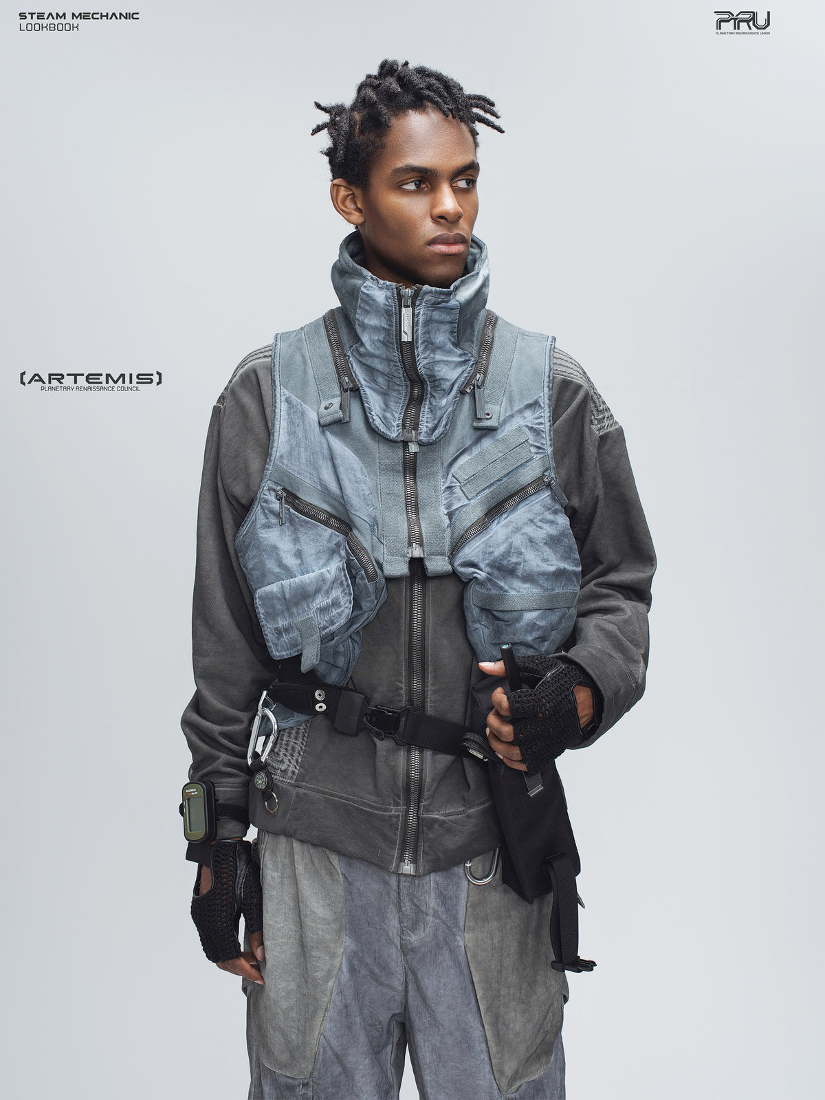 FISSION modular vest in star blue, front modeled pose with a hand at the pocket