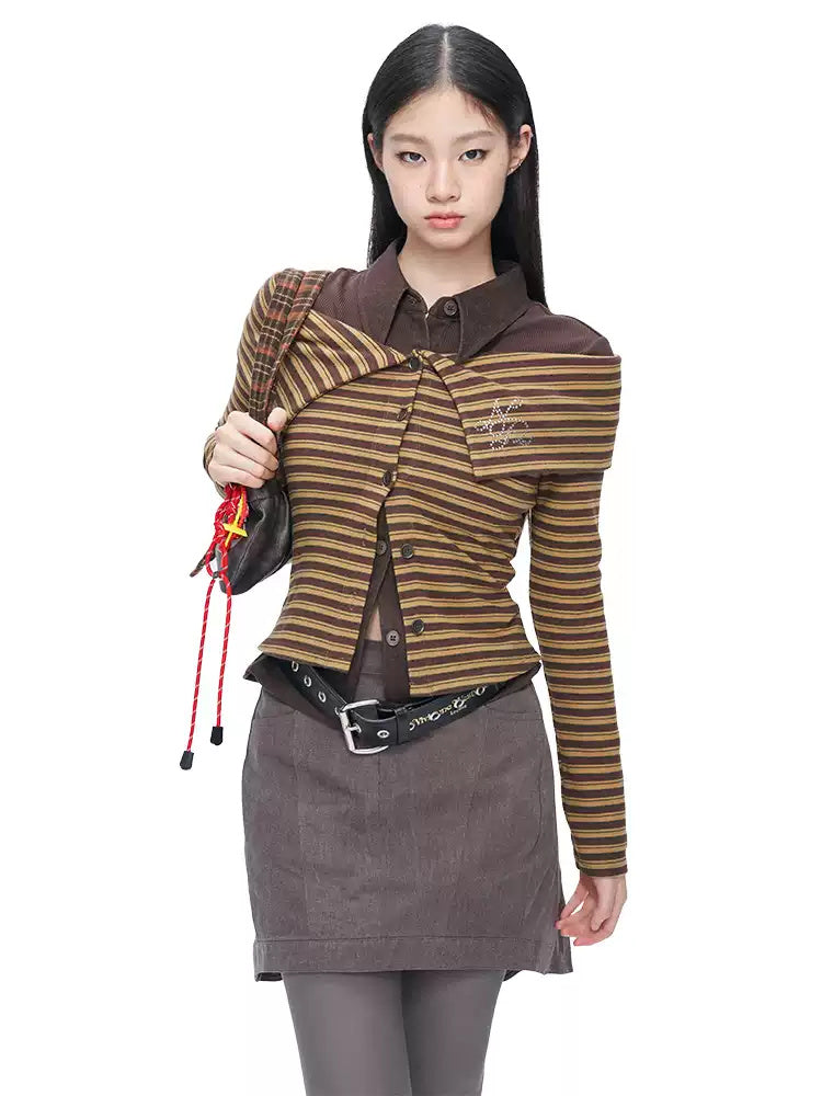 NEXT PASSPORT gray asymmetric cotton mini skirt — side modeled view showing the short front and pleated longer back.
