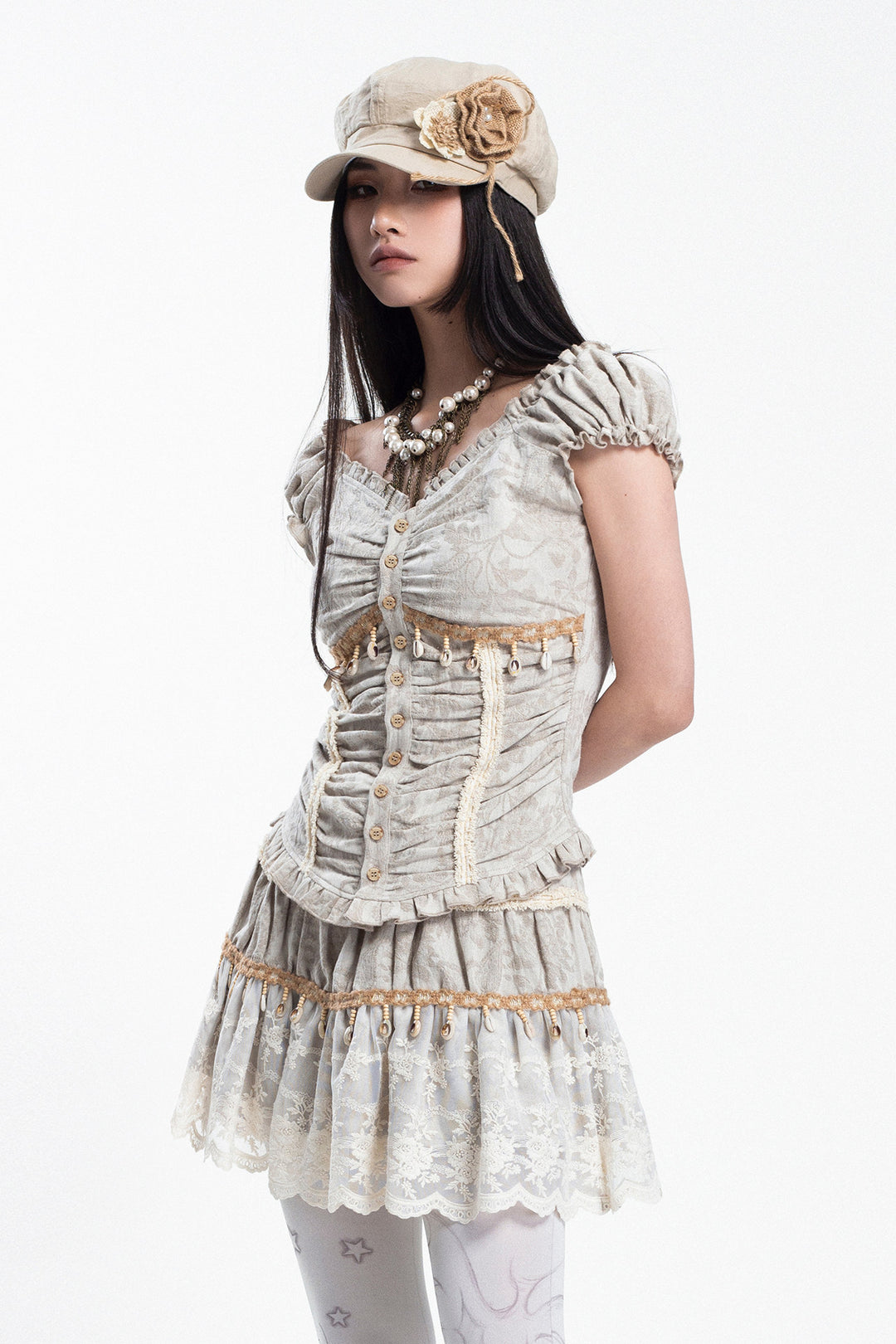 4RE1GN SHELL jacquard blouse and lace skirt separates in ivory — three-quarter studio modeled view of the ruched blouse and lace skirt