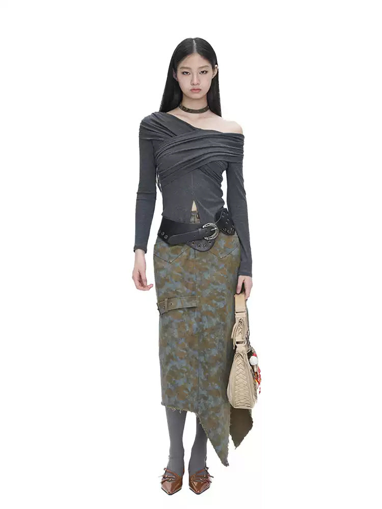 NEXT PASSPORT blue-brown tie-dye asymmetric denim midi skirt — full-length front modeled view with shoulder bag.
