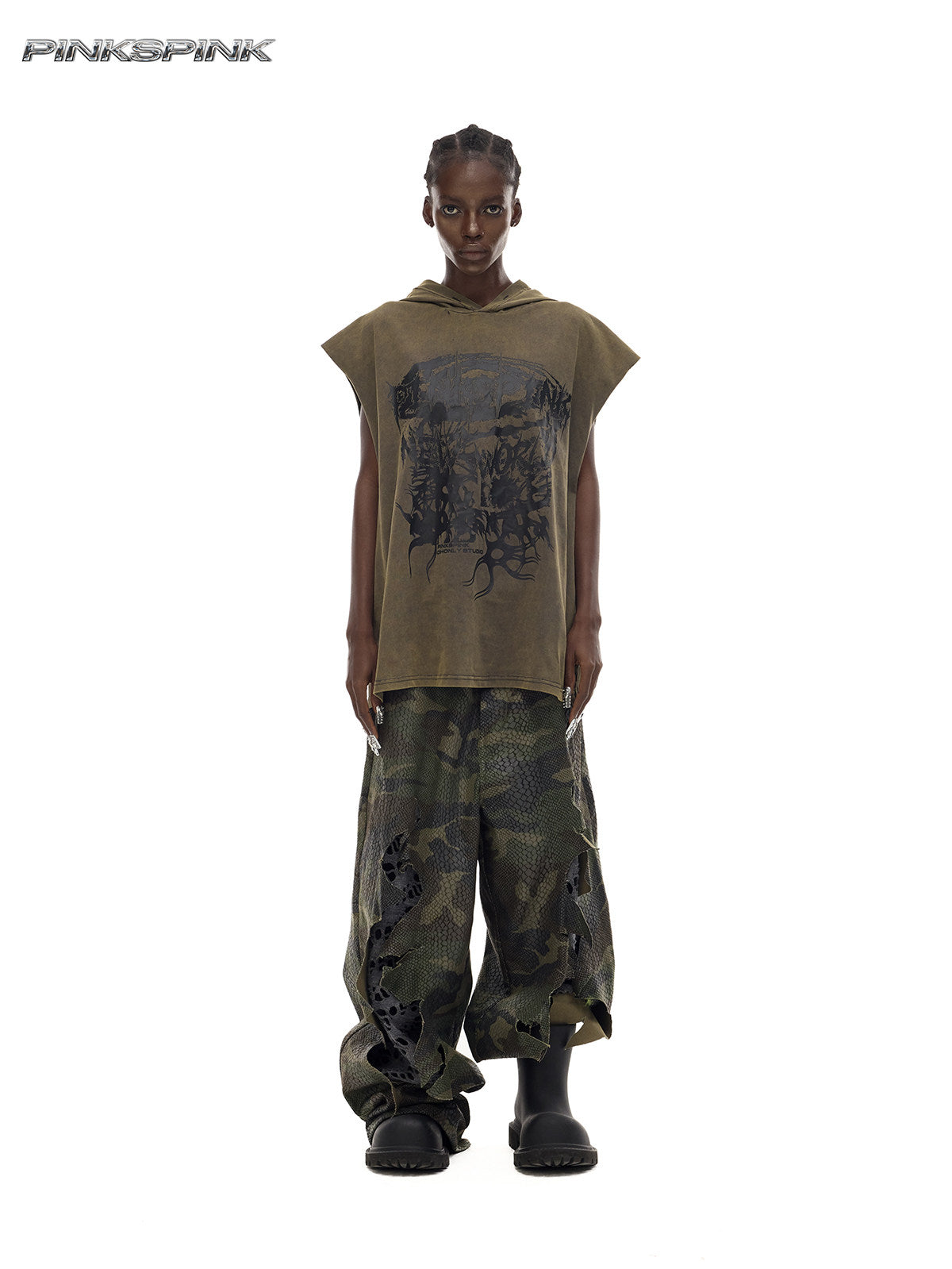 PINKSPINK DOUBLE STACK distressed camouflage wide-leg jeans — front full-length modeled view with an olive sleeveless top