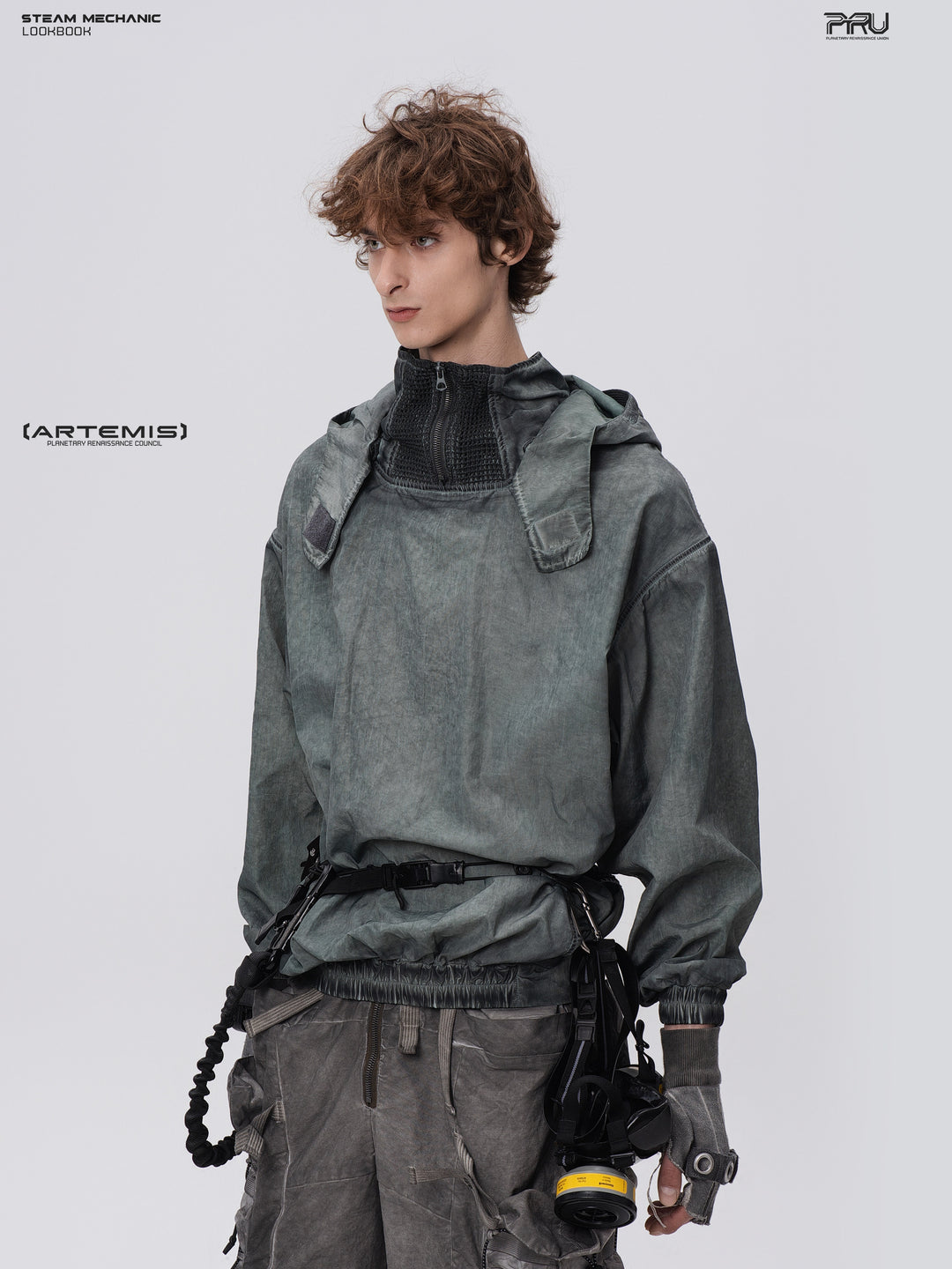 PIONEER detachable-hood mesh hoodie in moon shadow blue, front three-quarter view showing geometric shoulder panels