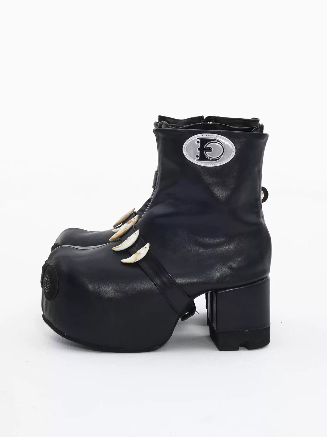 EMBRYO BONE LIFT detachable-bone platform boots — outer side view showing the circular EMBRYO patch and platform heel
