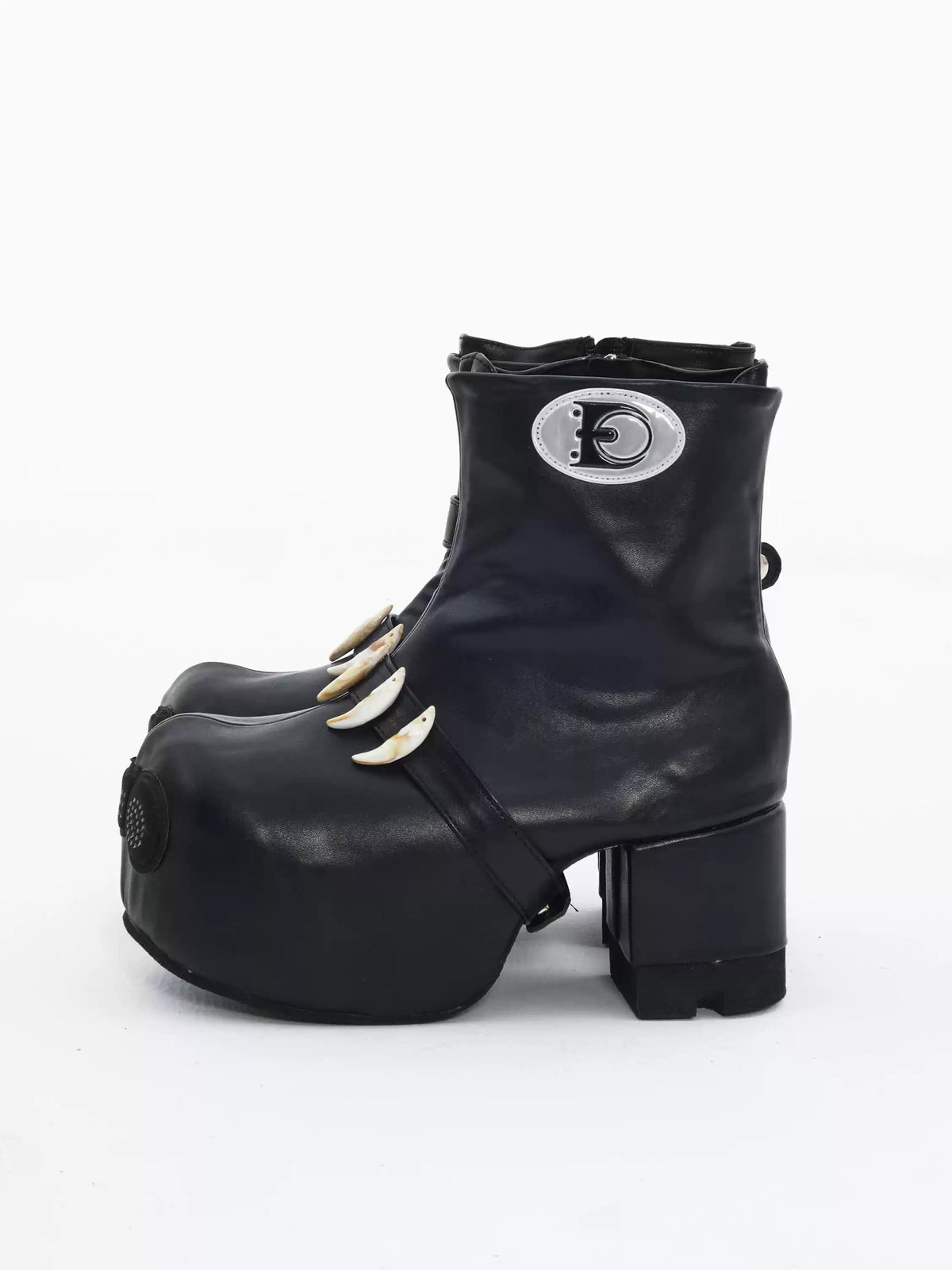 EMBRYO BONE LIFT detachable-bone platform boots — outer side view showing the circular EMBRYO patch and platform heel