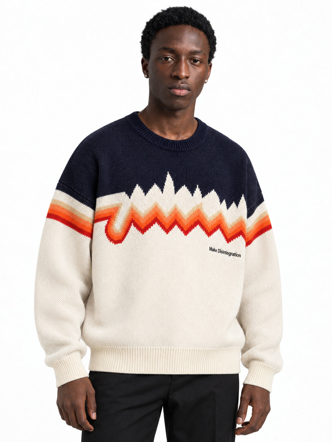 Male model wearing the oversized cream and navy zigzag knit sweater, front view.