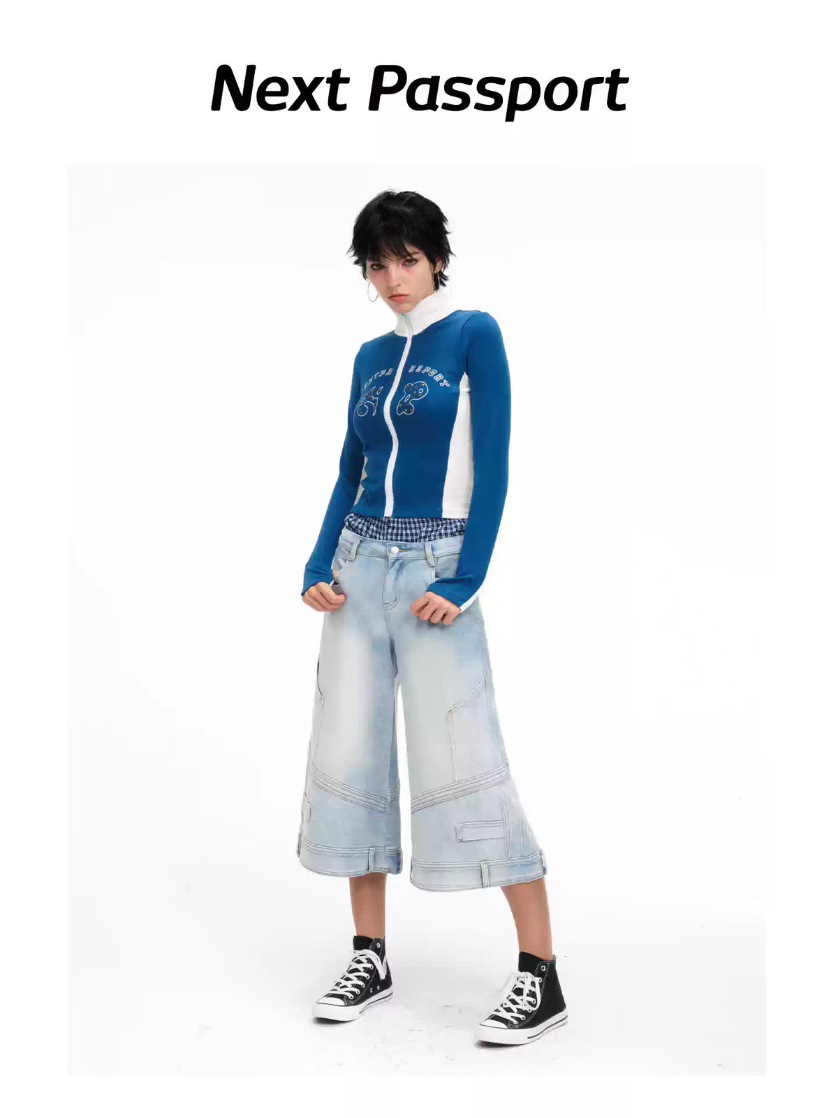 Front angled modeled view of the light-wash cropped jeans