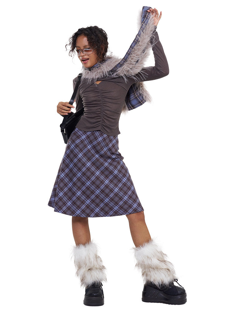NEXT PASSPORT blue-purple plaid faux-fur scarf — full-length modeled view with one end lifted