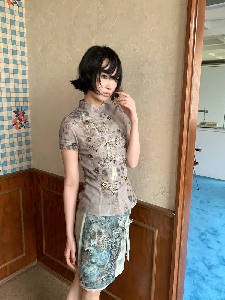 4RE1GN BLUE BLOOM tie-front layered skirt in blue multicolor — three-quarter modeled view showing the layered floral hem