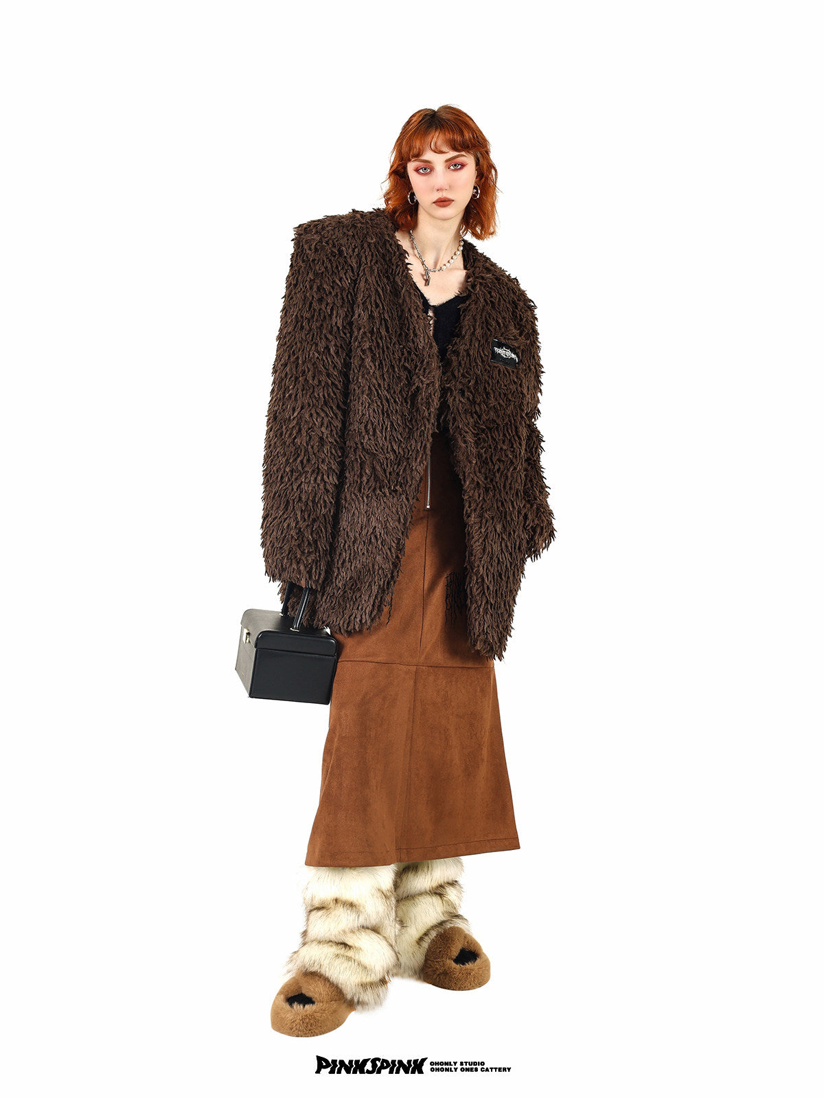 PINKSPINK caramel shaggy padded-shoulder jacket — angled front modeled view showing the V neckline