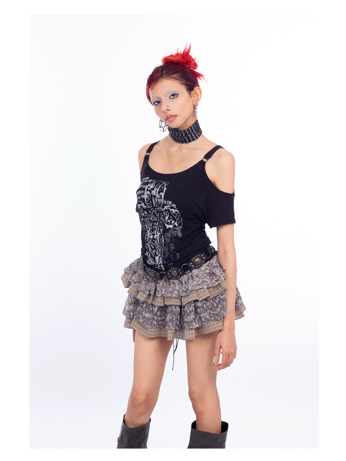 4RE1GN CROSS SCRIPT cold-shoulder tee in black — three-quarter modeled view of the shoulder cutouts