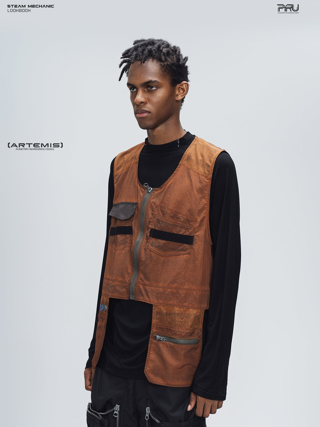 PIONEER sedna-red multi-pocket vest, left-facing three-quarter view showing mixed-fabric construction