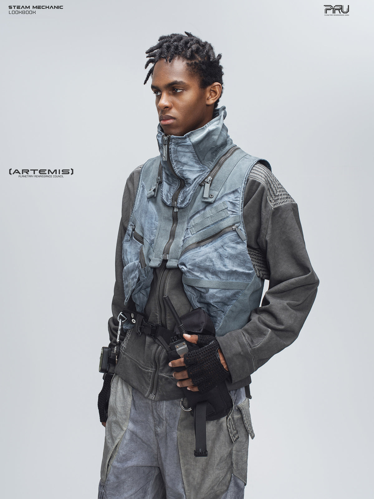 FISSION modular vest in star blue, three-quarter modeled view showing zip pockets and webbing