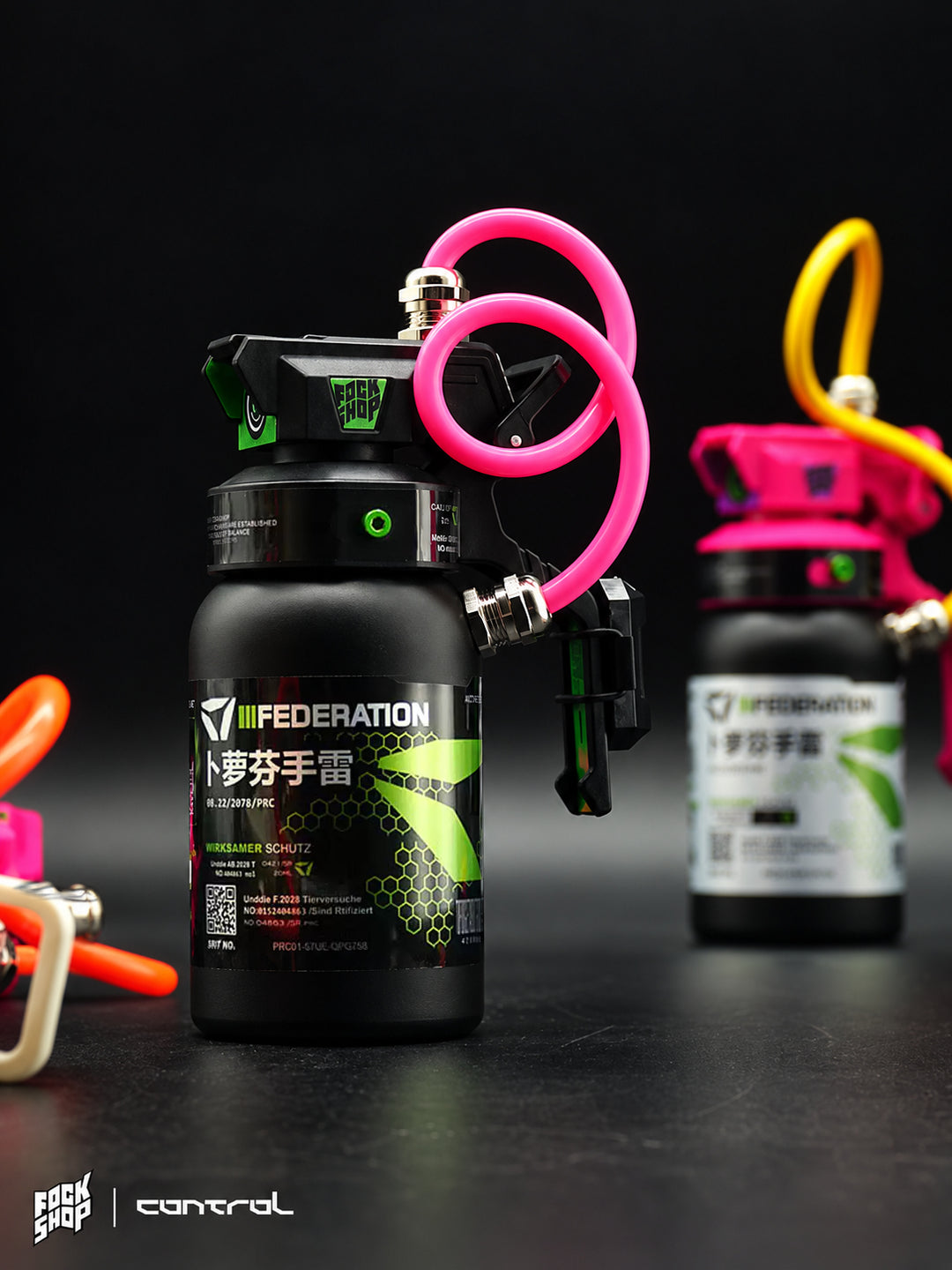 FOCKSHOP IBUPROFEN illuminated canister prop — pink-capped black canister with yellow hose under colored studio light