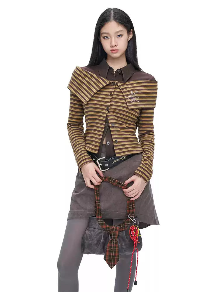 NEXT PASSPORT gray asymmetric cotton mini skirt — back modeled view emphasizing the pleated panel.