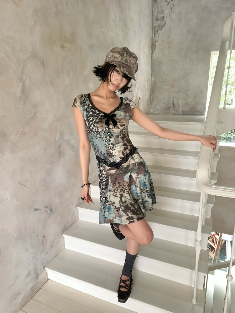 4RE1GN SEA BLUE leopard floral lace dress in gray blue — three-quarter modeled view on stairs