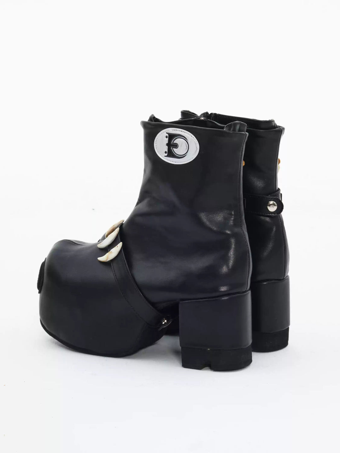 EMBRYO BONE LIFT detachable-bone platform boots — rear three-quarter view showing the heel profile and shaft seams