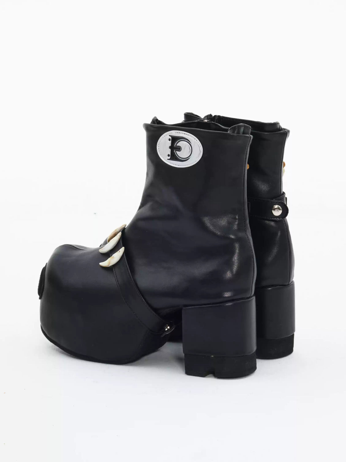 EMBRYO BONE LIFT detachable-bone platform boots — rear three-quarter view showing the heel profile and shaft seams