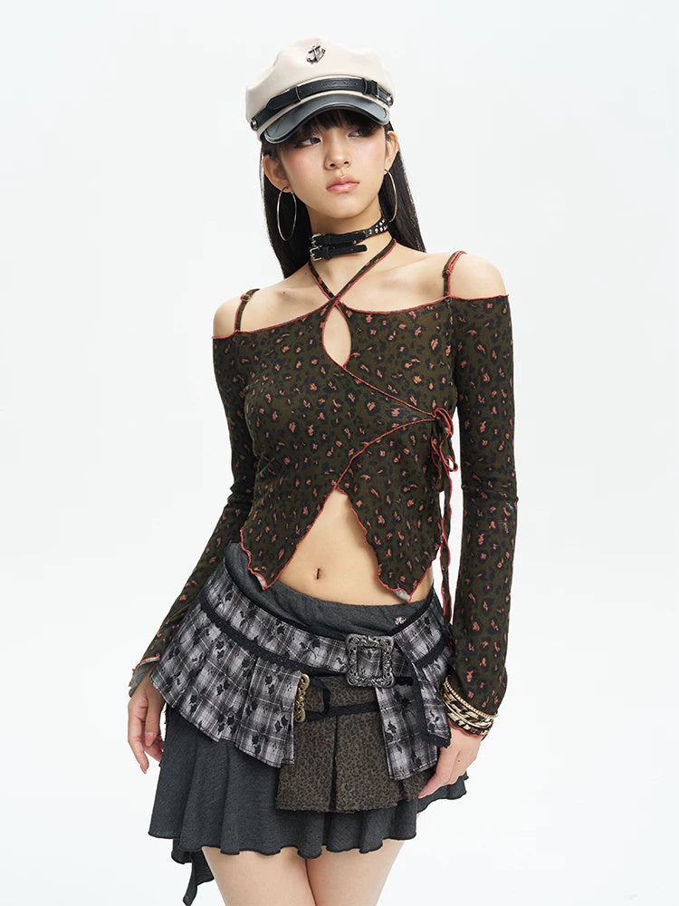 Front studio portrait showing the lace-up neckline and asymmetric hem