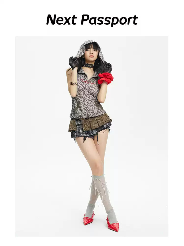 Full-length studio styling of the leopard-print hooded vest