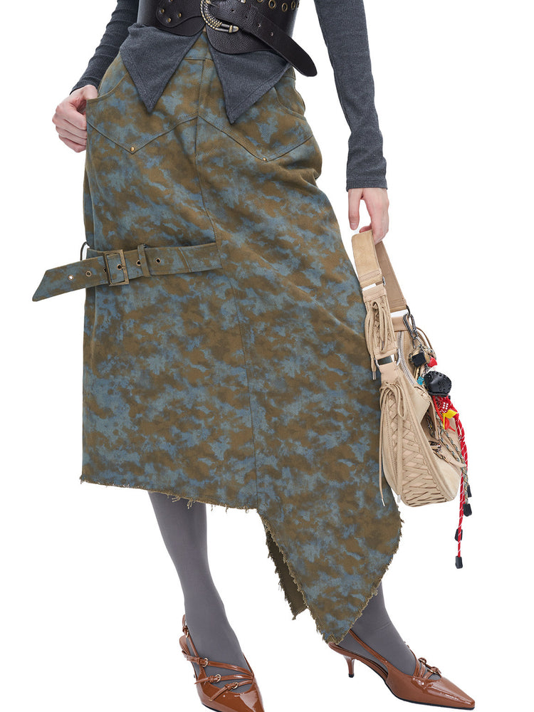 NEXT PASSPORT blue-brown tie-dye asymmetric denim midi skirt — modeled detail showing the raw asymmetric hem and side strap.