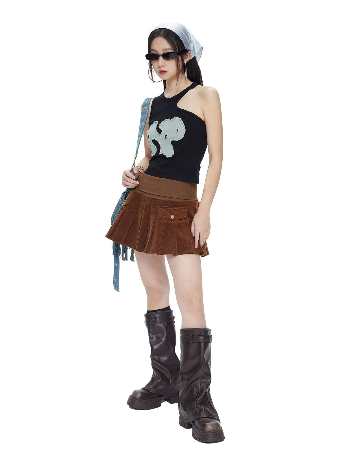 NEXT PASSPORT black-blue asymmetric appliqué cutout tank top — full-length styled view.