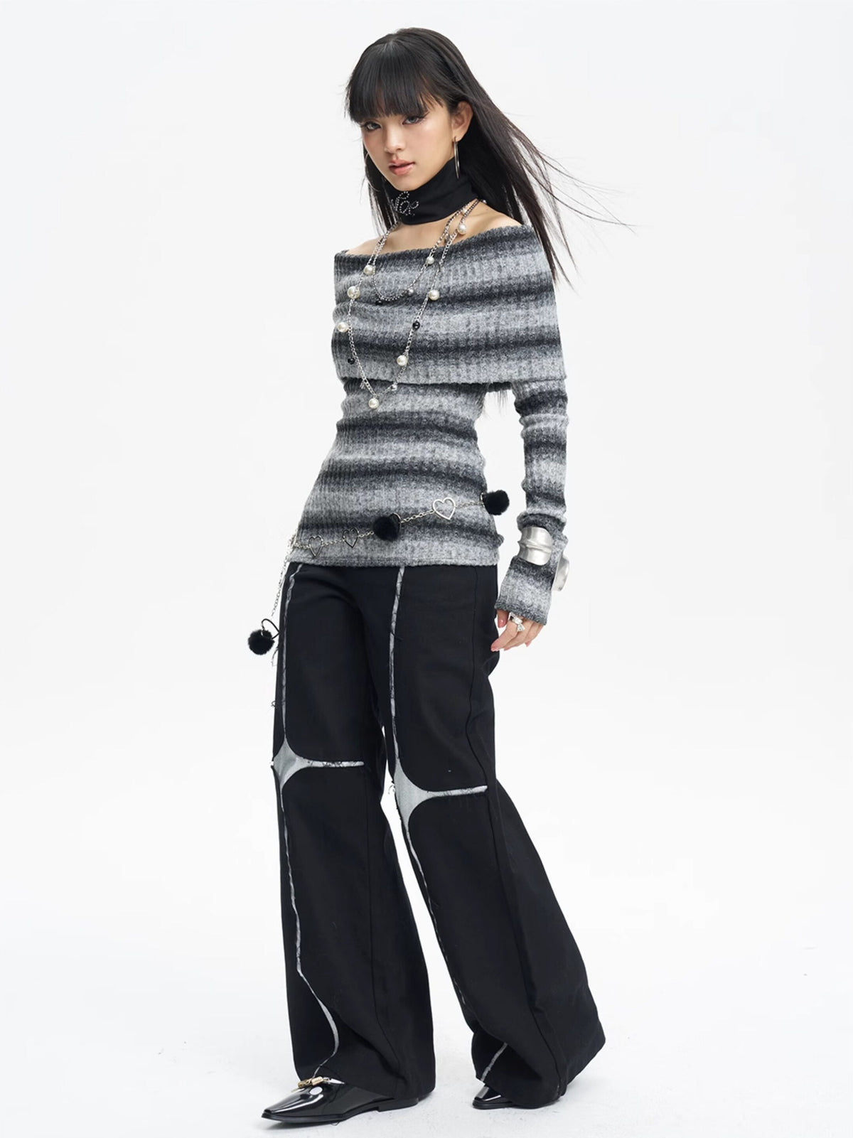 NEXT PASSPORT black silver-cross sequin wide-leg pants — angled full-length look.