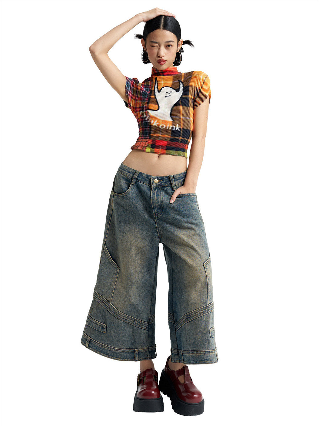 Raised-arm view of NEXT PASSPORT deconstructed wide-leg denim capri pants