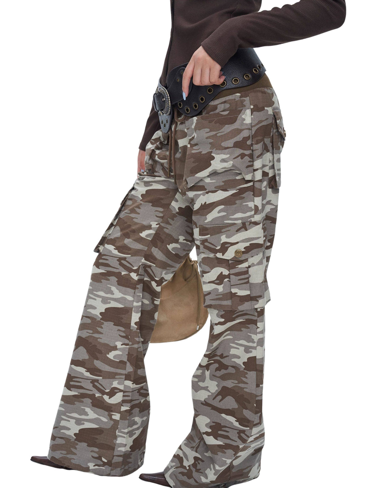 NEXT PASSPORT camouflage ribbed-waist flared pants — angled pants-focused studio view.