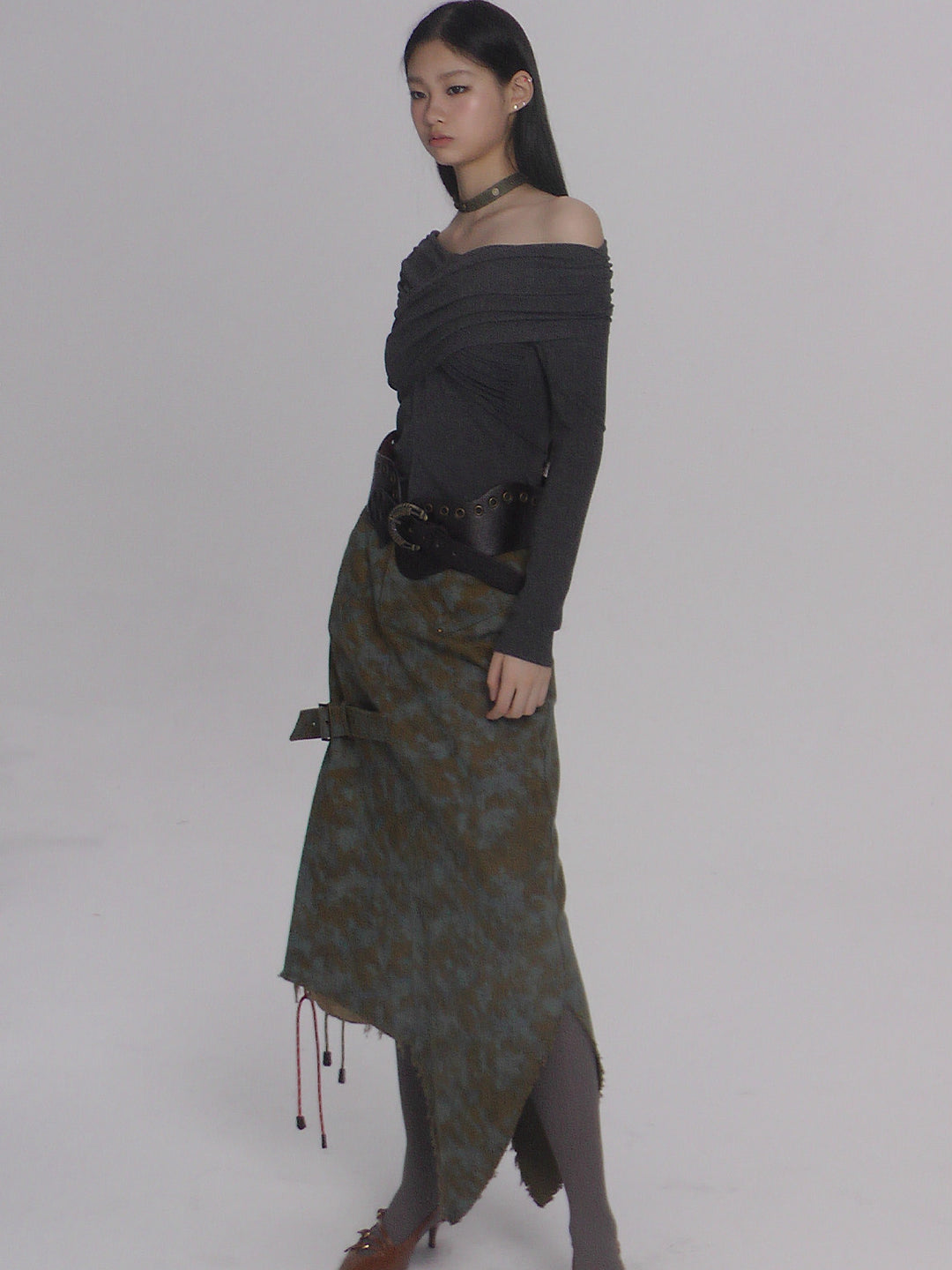 NEXT PASSPORT blue-brown tie-dye asymmetric denim midi skirt — side modeled view showing the draped silhouette.