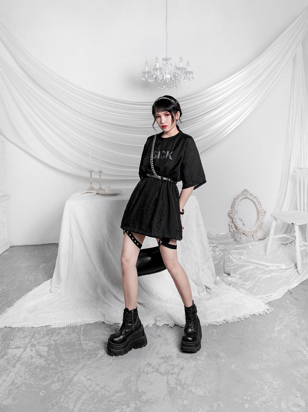 WRAVEN gathered faux-leather curb-chain belt — original full-length styling with black gathered strap and silver-tone chain.