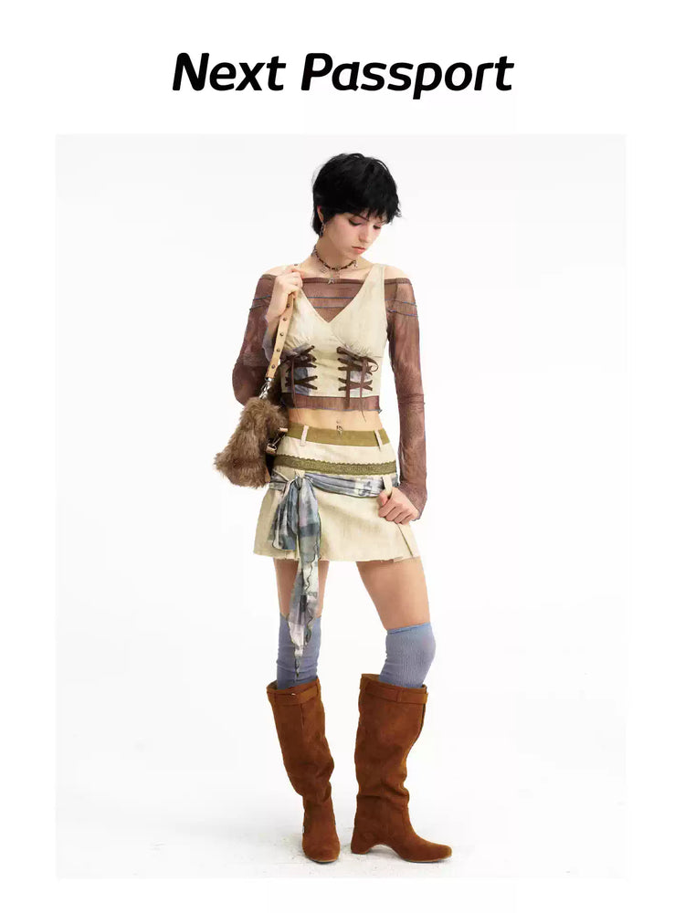 Modeled view of the double-lace vest and tie-detail skirt