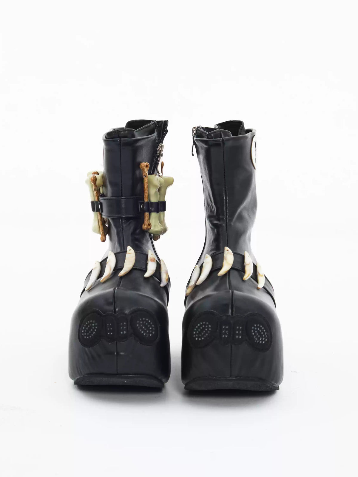 EMBRYO BONE LIFT detachable-bone platform boots — straight front view showing the detachable bone ornaments and rounded toes