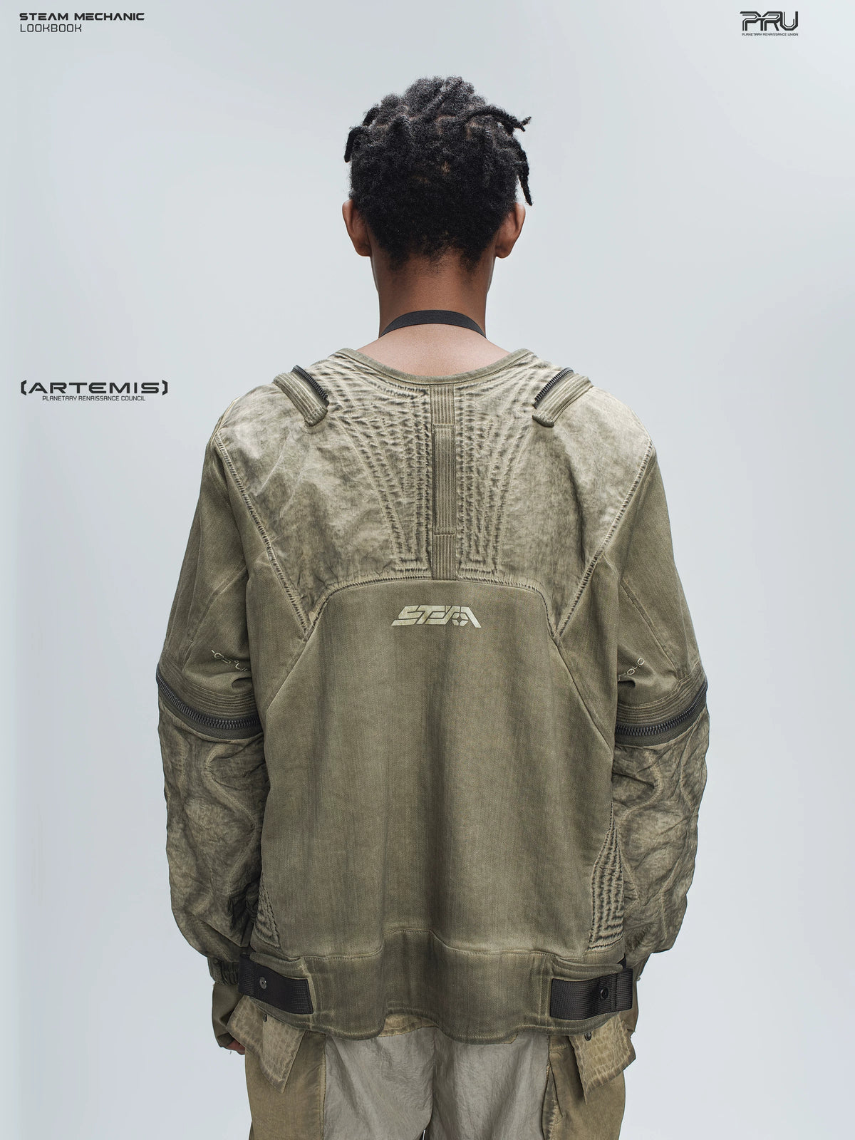 STEAM FUNCTION PIONEER mercury-brown detachable-sleeve jacket, rear view showing gathered paneling, logo and hem tabs
