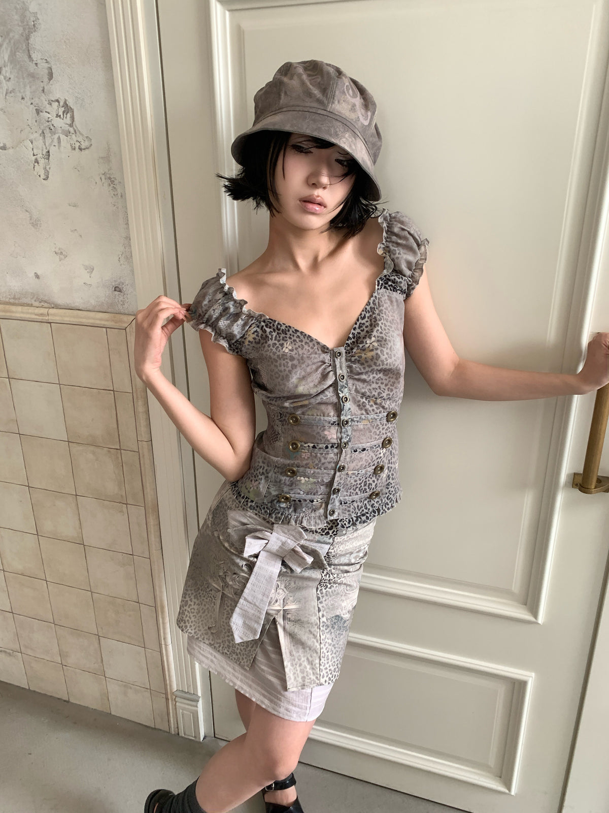 4RE1GN CROSS LEOPARD bow-detail layered skirt in beige multicolor — angled modeled view styled with a ruffled vest
