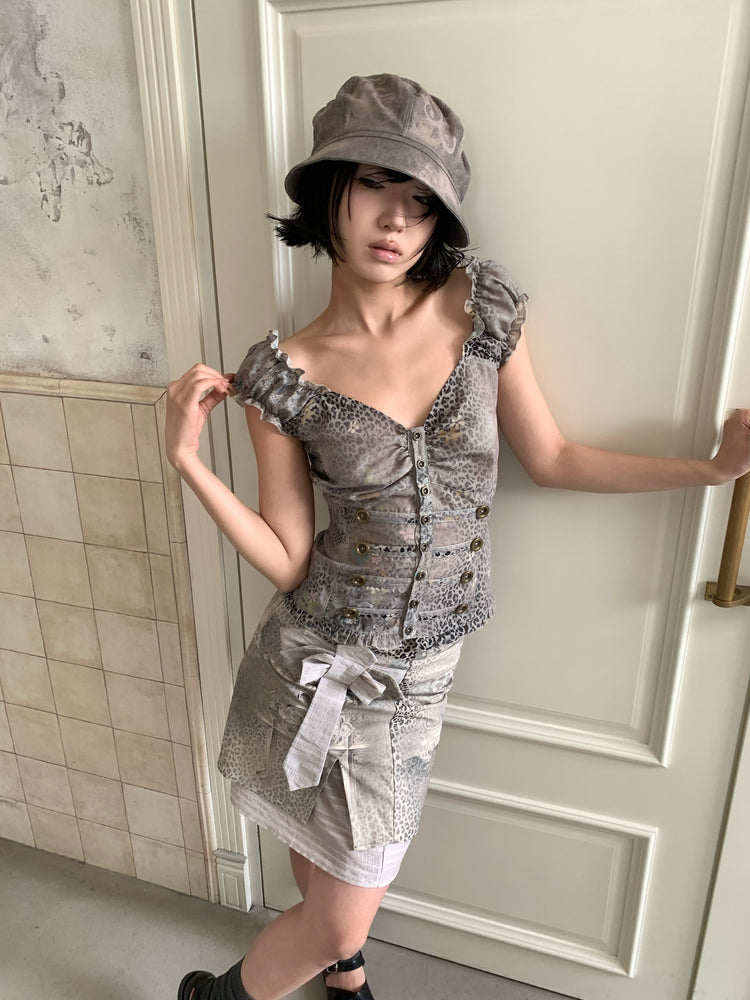 4RE1GN CROSS LEOPARD bow-detail layered skirt in beige multicolor — angled modeled view styled with a ruffled vest