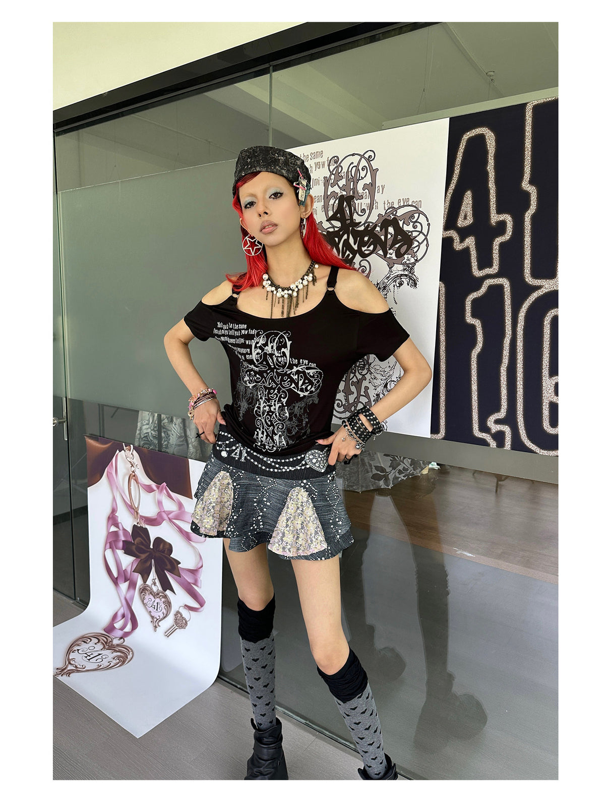 4RE1GN JEWEL denim-print lace mini skirt in black multicolor — full-length modeled view beside the brand display