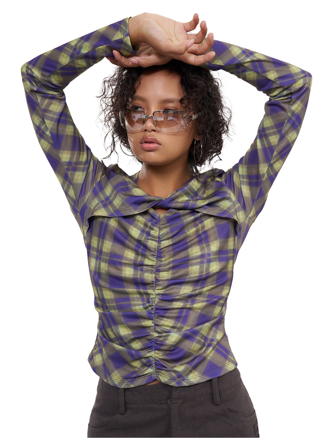 NEXT PASSPORT cross-neck ruched long-sleeve tee in green-purple plaid, raised-arm view